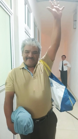 Jorge Santiago raises his hand as he smiles of excitement after he is baptized at the Central Adventist Church in Mexico City, June 22, 2023. Santiago was practicing Santeria witchcraft before he left it all behind and decided to accept Jesus. [Photo: Fabiola Quinto]